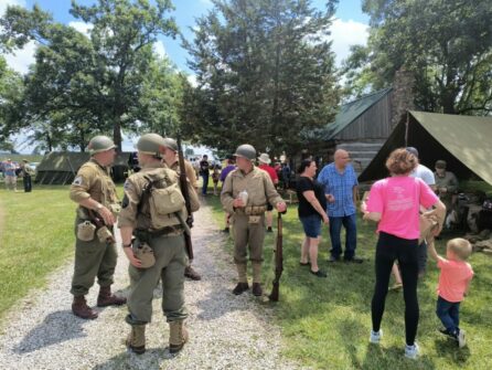 People dressed as soldiers after a WWII reenactment at Auglaize Village